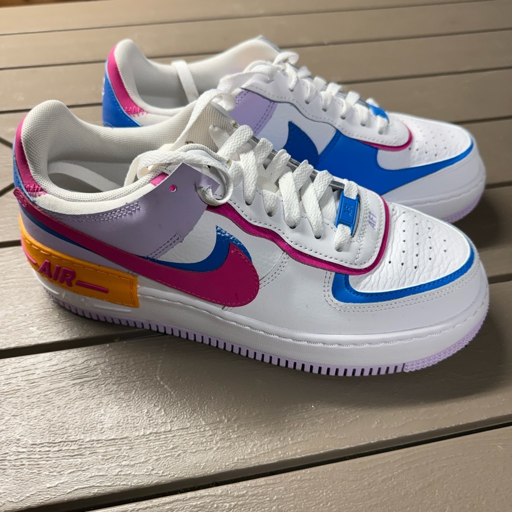 Nike Air Sneakers with Blue and Pink Accents